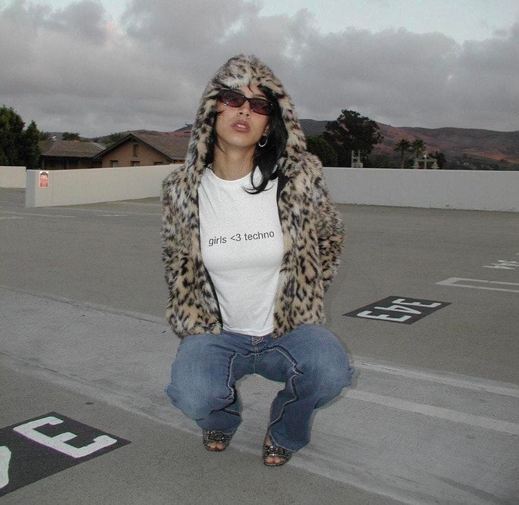 White graphic baby tee with "Girls <3 techno" print