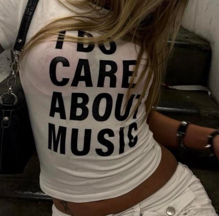 White & Black I Do Care About Music baby tee